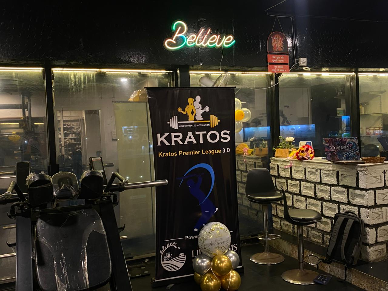 Kratos Fitness nighttime storefront with neon signage